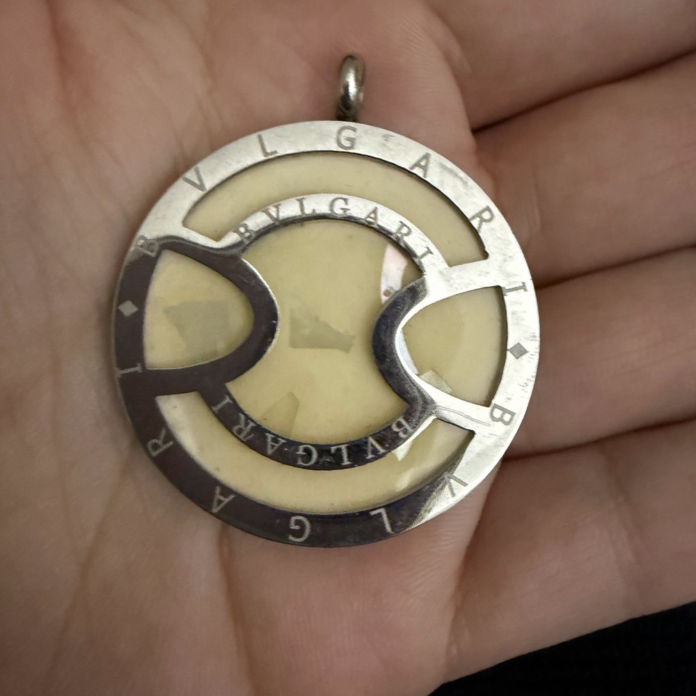 Bulgari Silver and Cream Circular Logo Pendant Necklace
